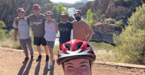 Group of Friends Pose for Selfie Photo in front of Scenic Lake View