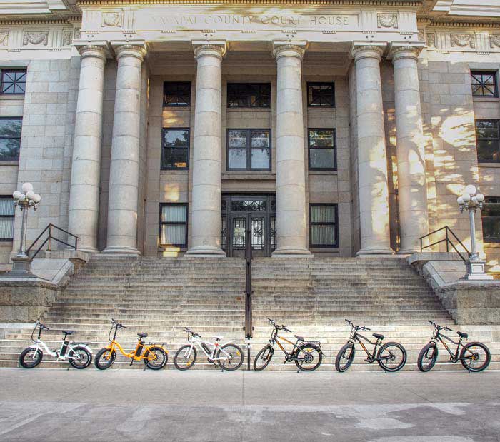 Row of Ebikes Parked in Front of Courthouse Steps